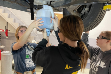 students-changing-oil-in-automotive-shop